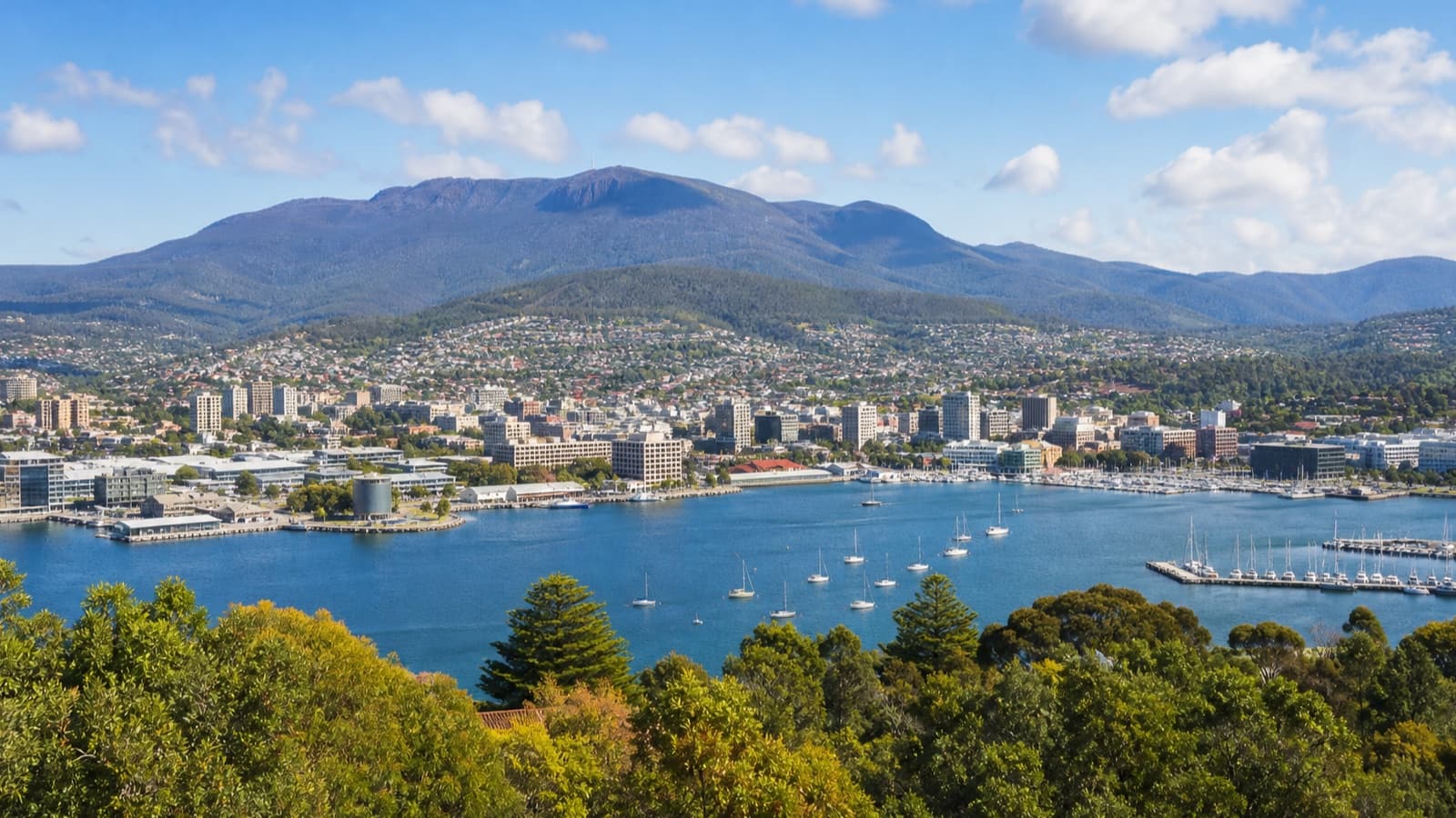 An original editorial view of Hobart's waterfront and surrounding Tasmanian hills.